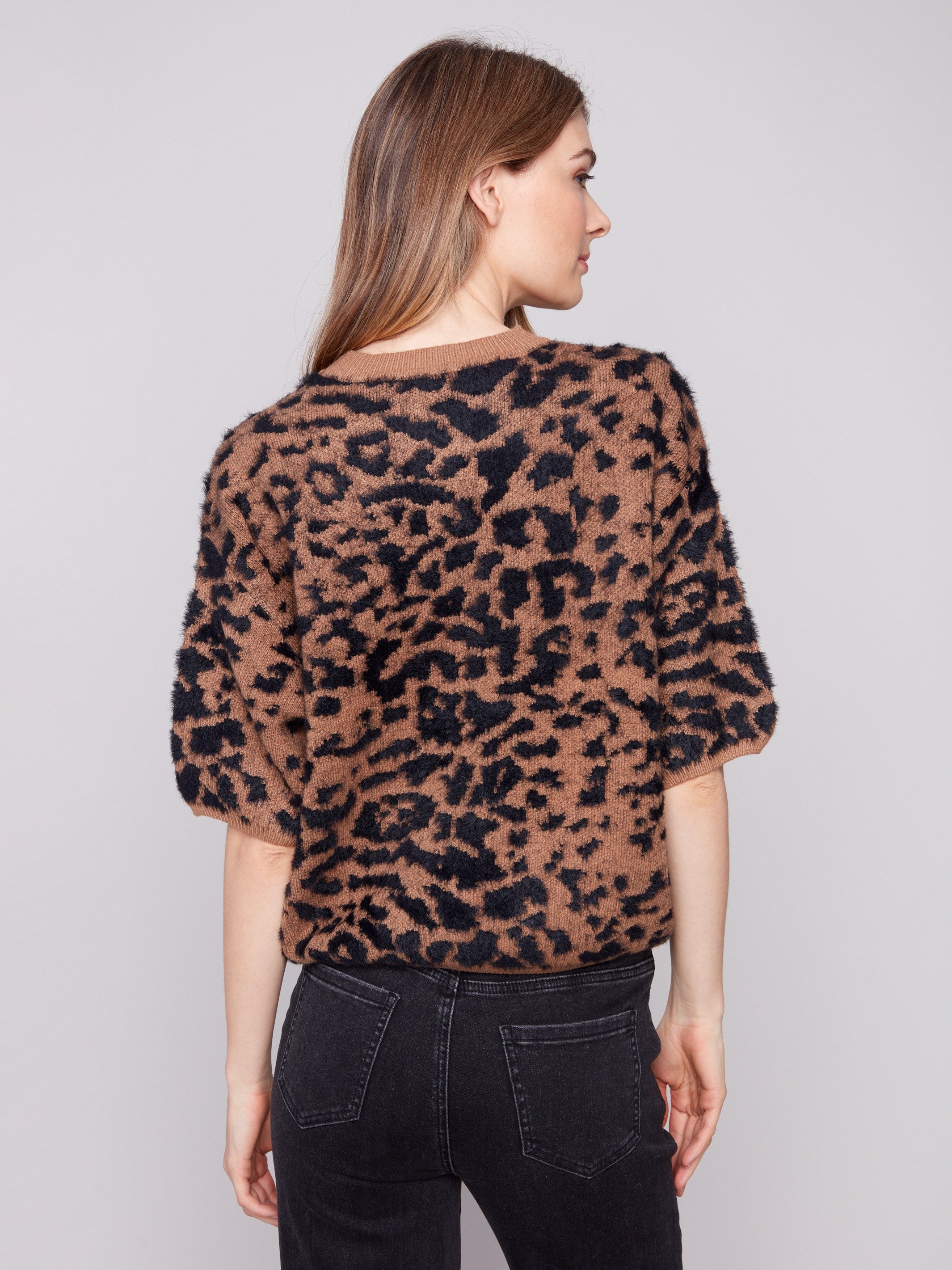 Elegant knit sweater with a unique leopard design and crew neckline for casual chic style by Charlie B.