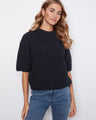 This sweater features a chic mock neck design, offering a stylish touch to your casual wardrobe. By Charlie B.