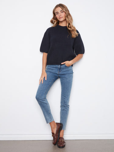 Crafted from soft brushed knit, this sweater ensures comfort and warmth for everyday wear. By Charlie B.