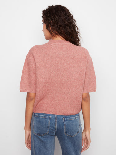The relaxed fit provides ease and style, making it a wardrobe essential this season. By Charlie B.