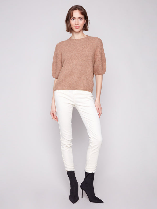 Elegant balloon-shaped elbow sleeves add a stylish touch to this knit sweater by Charlie B.