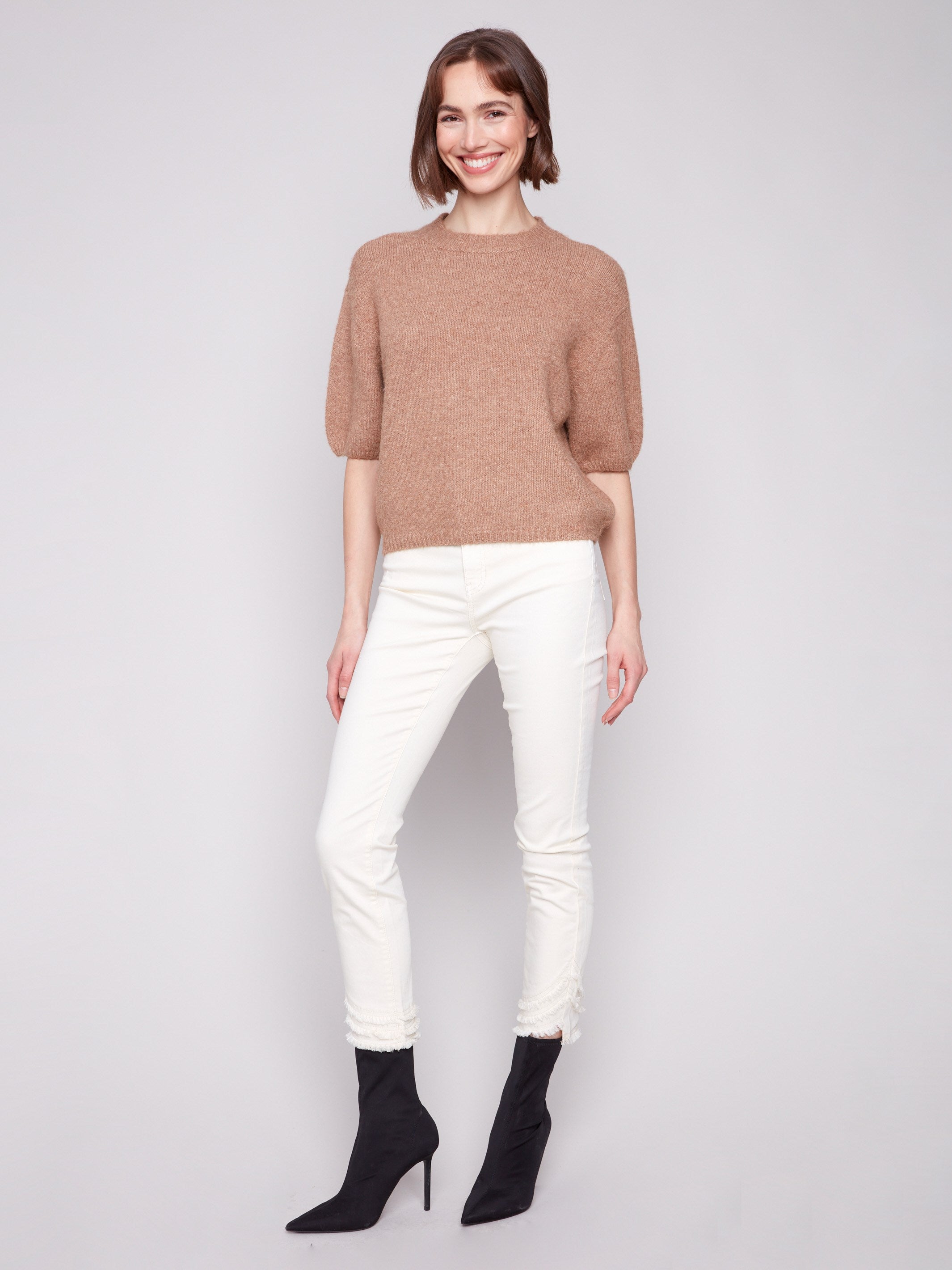 Soft knit with crew neckline ensures comfort and style in this sesame sweater by Charlie B.