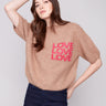 Truffle sweater with a crew neckline and graphic 'LOVE' text, perfect for casual outings by Charlie B.