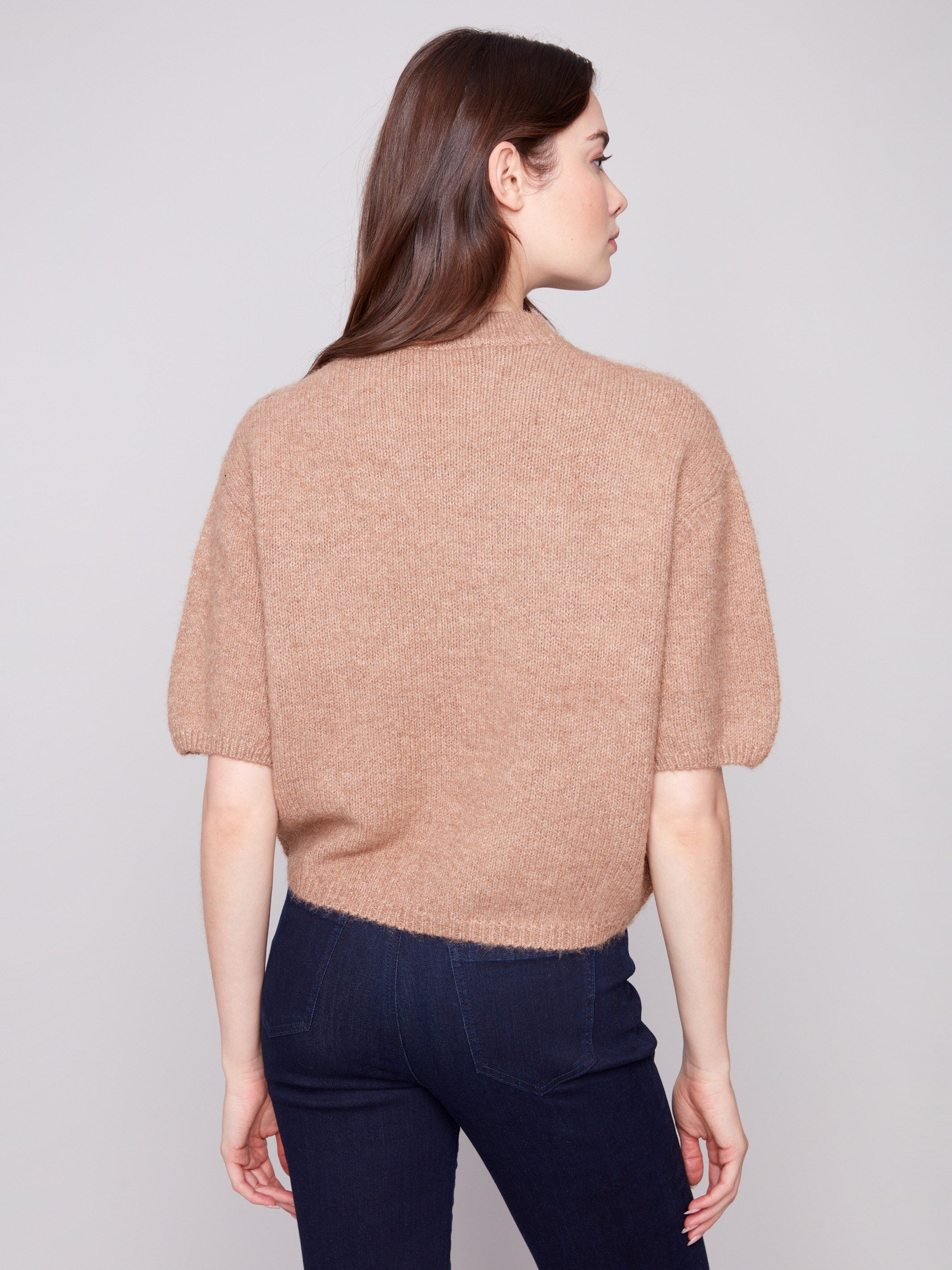 Knit sweater in truffle color with a relaxed fit and eye-catching graphic detail, ideal for any wardrobe by Charlie B.