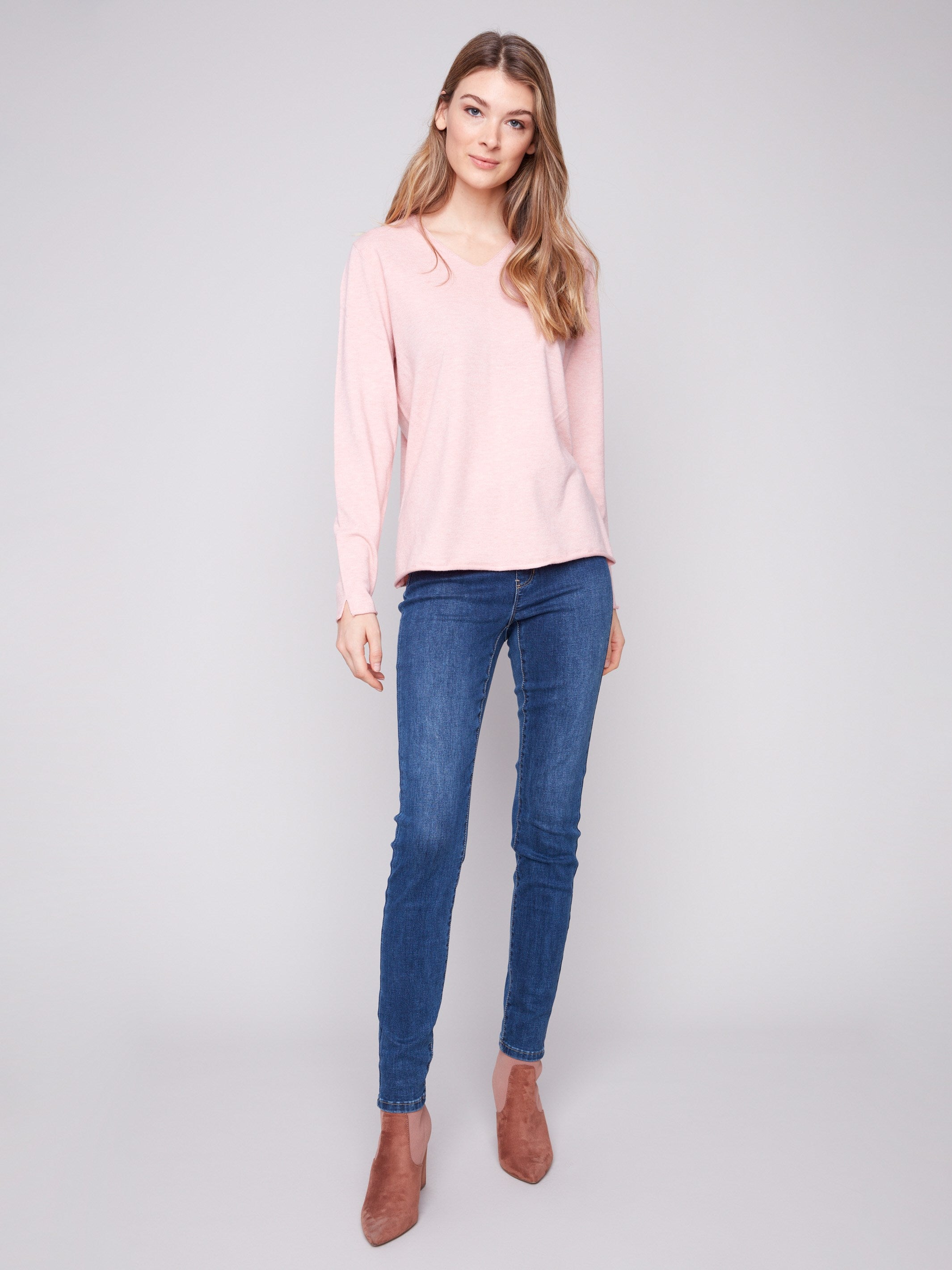 Elegant V-neck sweater featuring long sleeves and a cozy fit, perfect for layering by Charlie B.