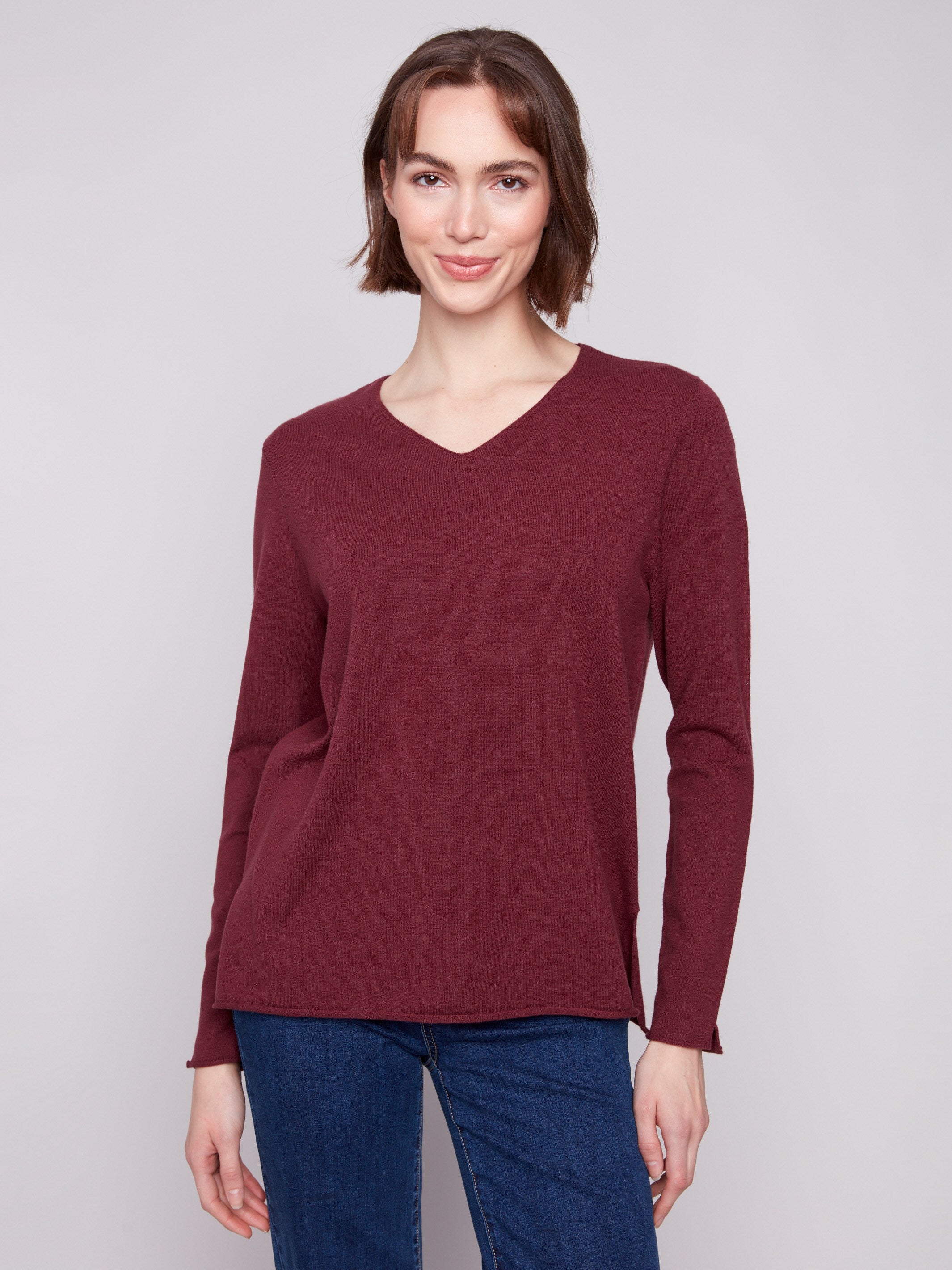Cabernet sweater with a V neckline and long sleeves, offering a plush texture for ultimate comfort by Charlie B.