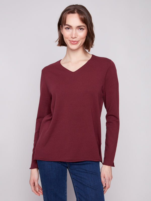 Cabernet sweater with a V neckline and long sleeves, offering a plush texture for ultimate comfort by Charlie B.