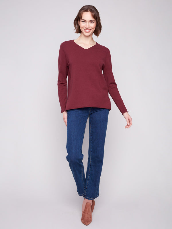 Elegant Cabernet sweater featuring side slits on sleeves and hem, designed for a relaxed fit by Charlie B.