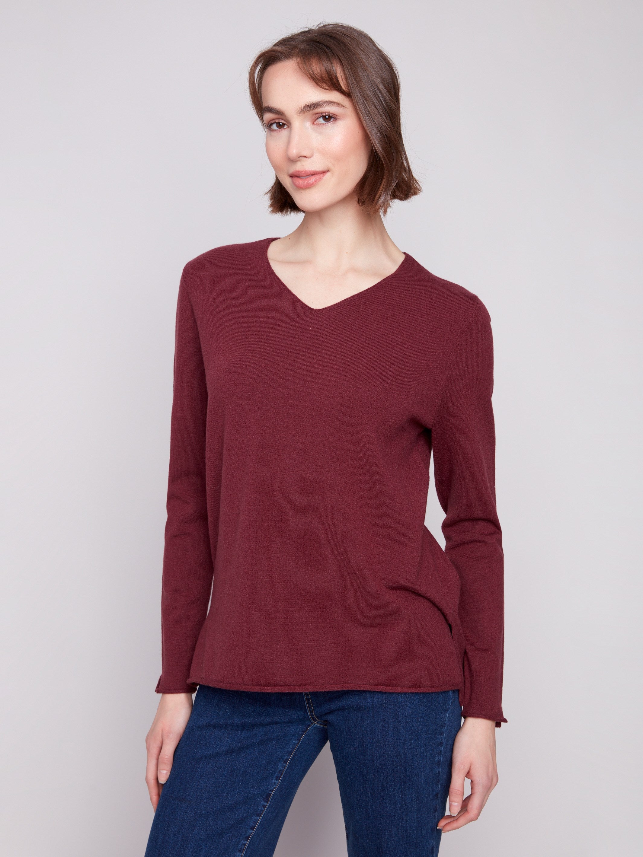 Classic Cabernet V-neck sweater with cozy long sleeves and plush texture, perfect for layering by Charlie B.