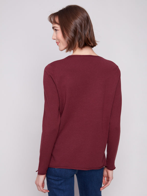 Stylish Cabernet sweater showcasing side slits on hem, adding a modern touch to its timeless design by Charlie B.