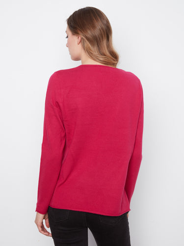 Experience the soft knit fabric that ensures comfort and warmth in any setting, making it a wardrobe staple. By Charlie B.