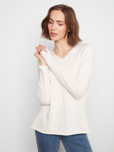 Elegant V-neckline design crafted from soft knit fabric for ultimate comfort. By Charlie B.