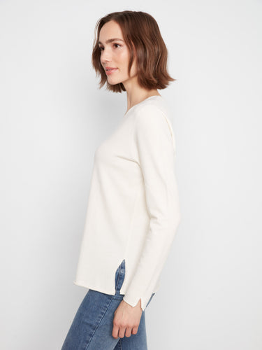 Chic side slits add a stylish touch to this versatile long sleeve top. By Charlie B.