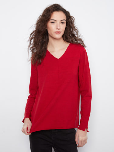 Red top with a flattering V-neckline, perfect for layering or wearing alone. Crafted in soft knit for comfort by Charlie B.