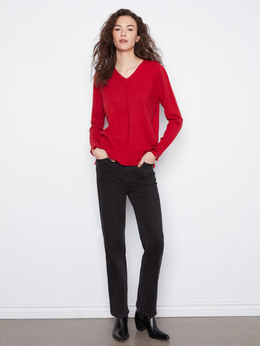 Enjoy the relaxed fit of this red knit top, ensuring both comfort and style throughout your day. Made by Charlie B.