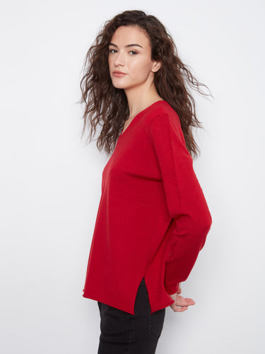 Made from a soft knit fabric, this red top offers coziness and elegance combined for everyday wear by Charlie B.