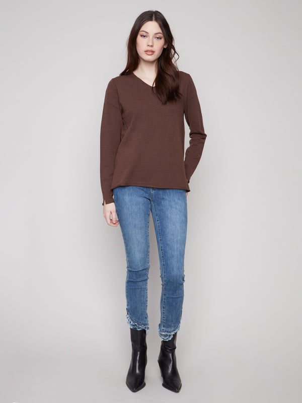Elegant long-sleeve mocha sweater featuring side slits on sleeves and hem, ideal for a chic look by Charlie B.