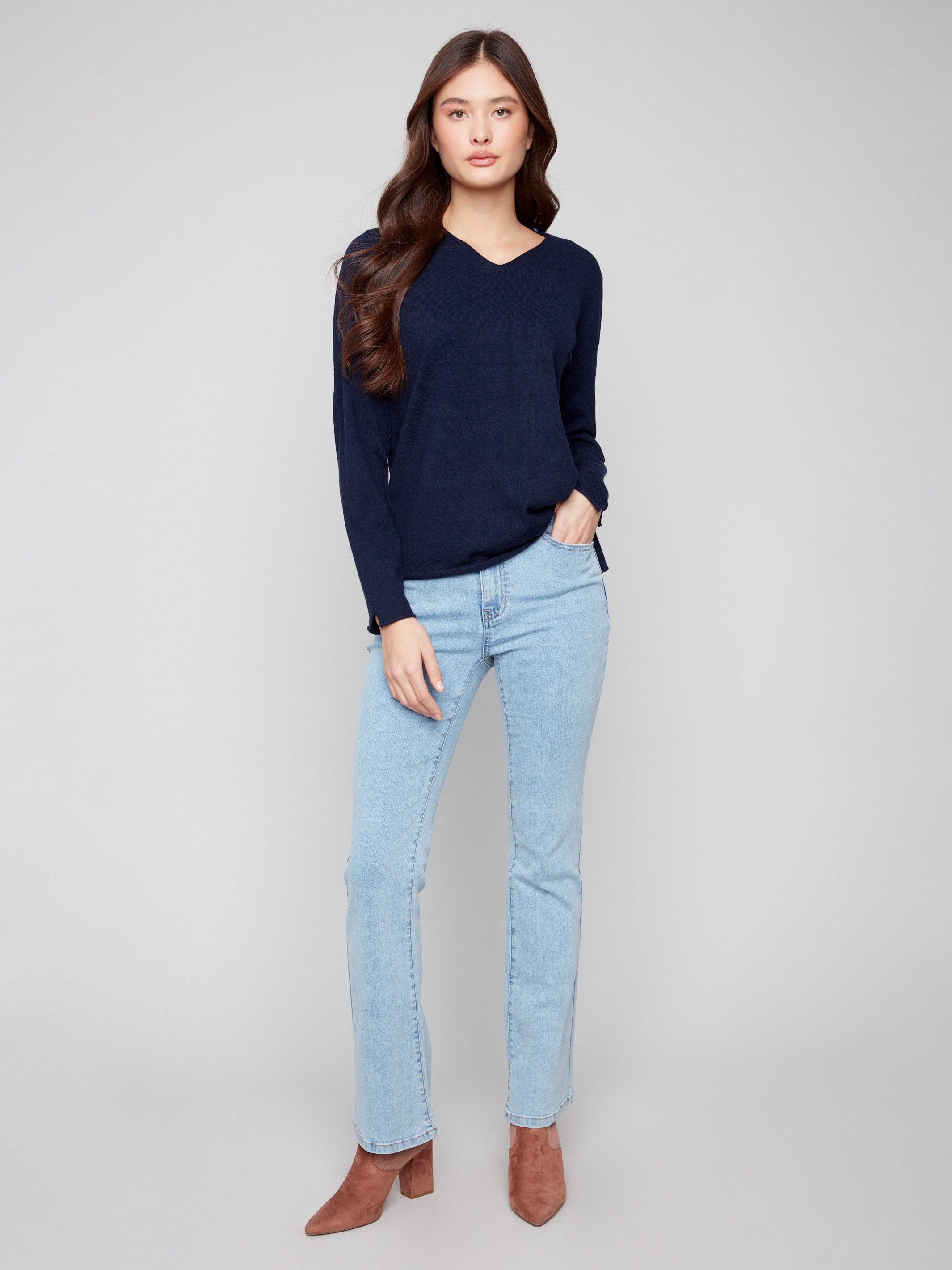 Elegant navy sweater with long sleeves, designed for a timeless look that complements any wardrobe by Charlie B.