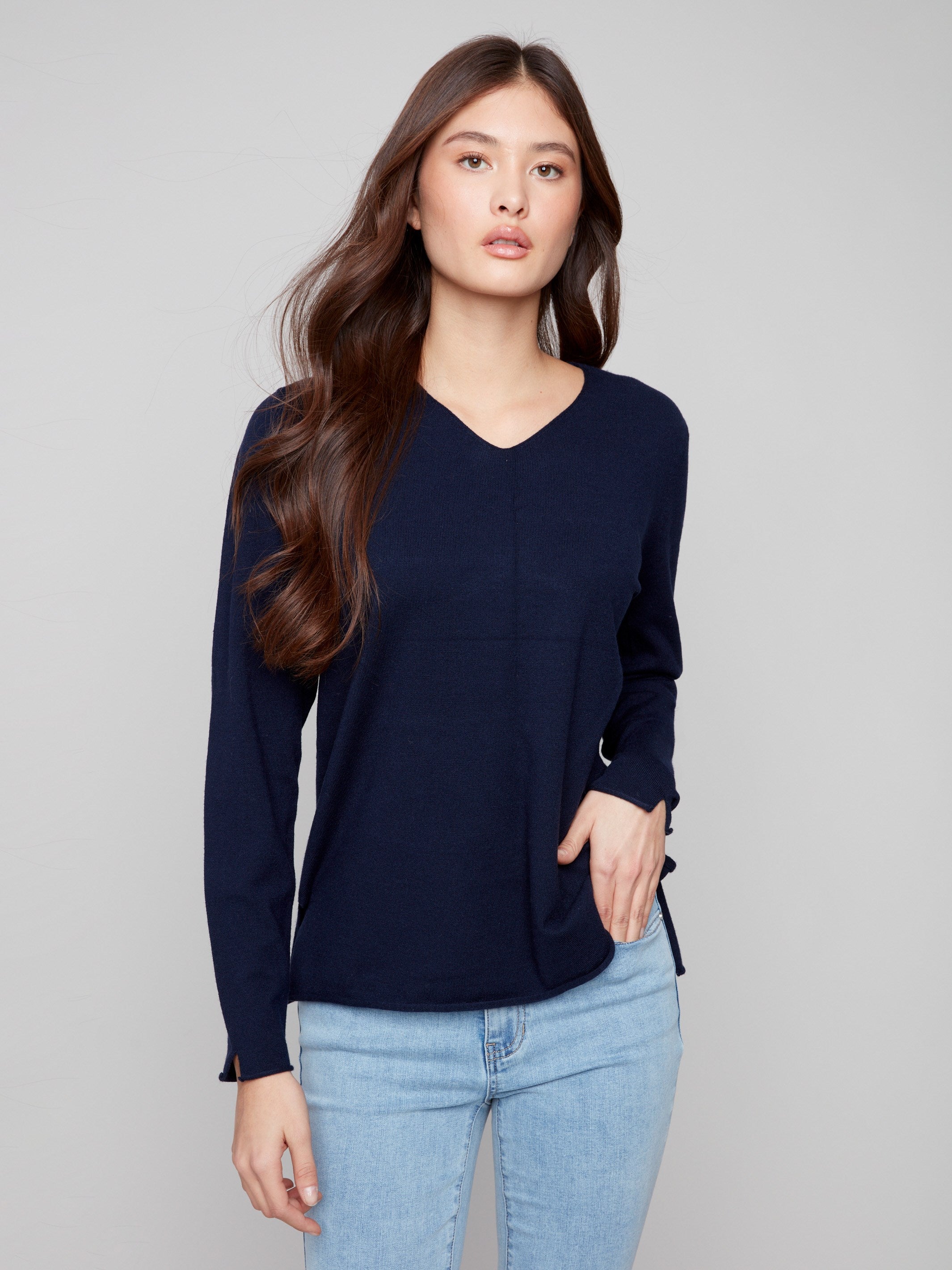 Classic navy sweater with V neckline, perfect for layering or wearing alone for effortless elegance by Charlie B.