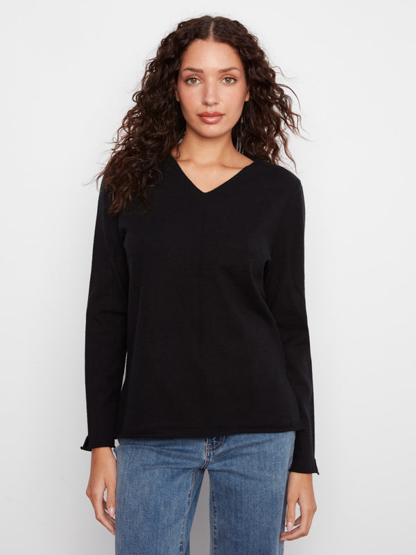 Black sweater with side slits for added style by Charlie B.