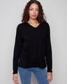 Black sweater with plush texture and refined V neckline, showcasing timeless style by Charlie B.