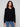 Black sweater with plush texture and refined V neckline, showcasing timeless style by Charlie B.