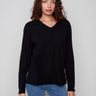 Black sweater with plush texture and refined V neckline, showcasing timeless style by Charlie B.