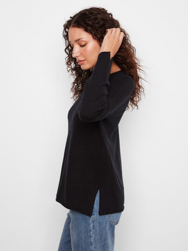Black sweater featuring a relaxed fit for comfort by Charlie B.