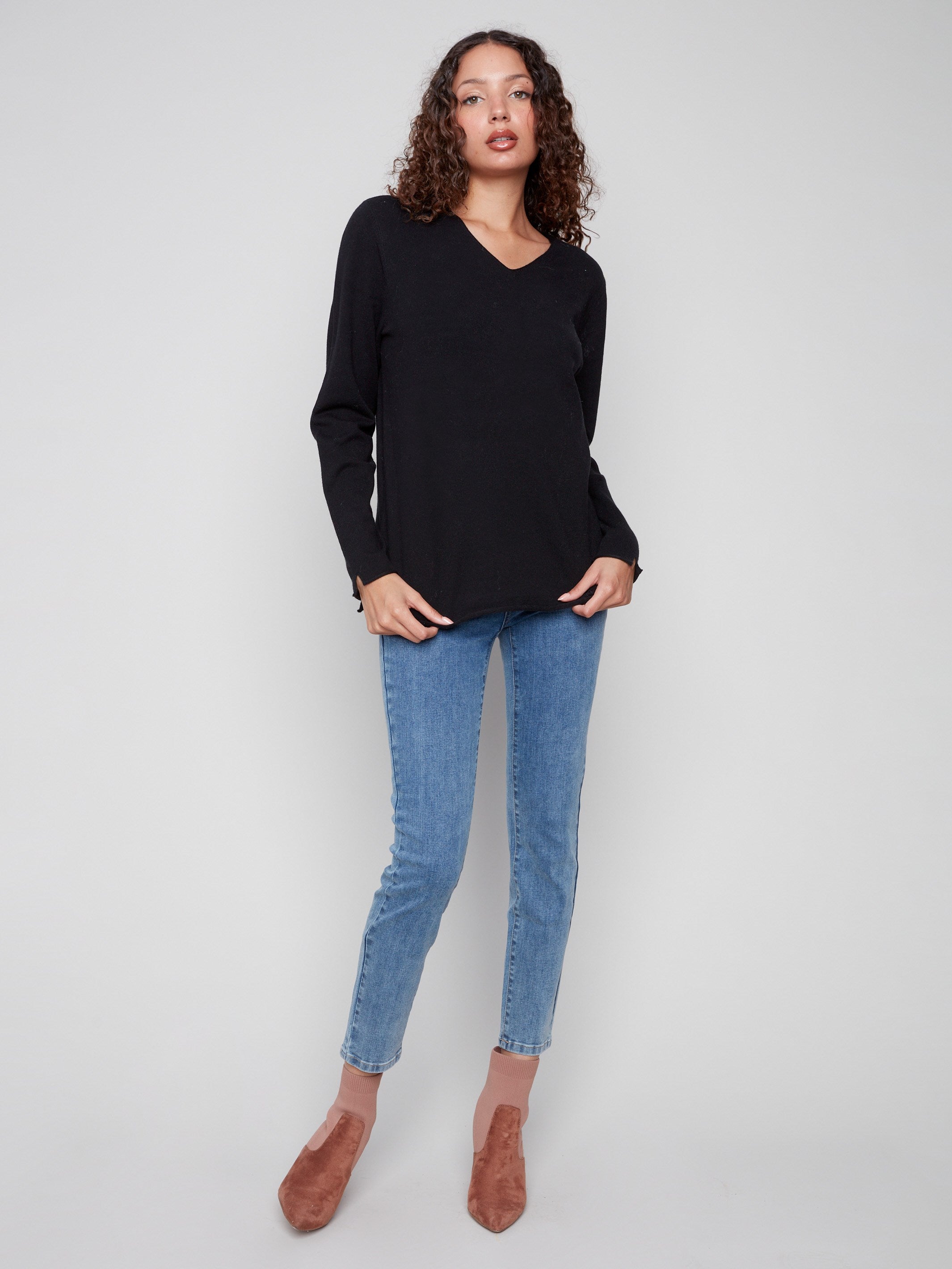 Elegant black sweater featuring long sleeves and a sophisticated design for a chic look by Charlie B.