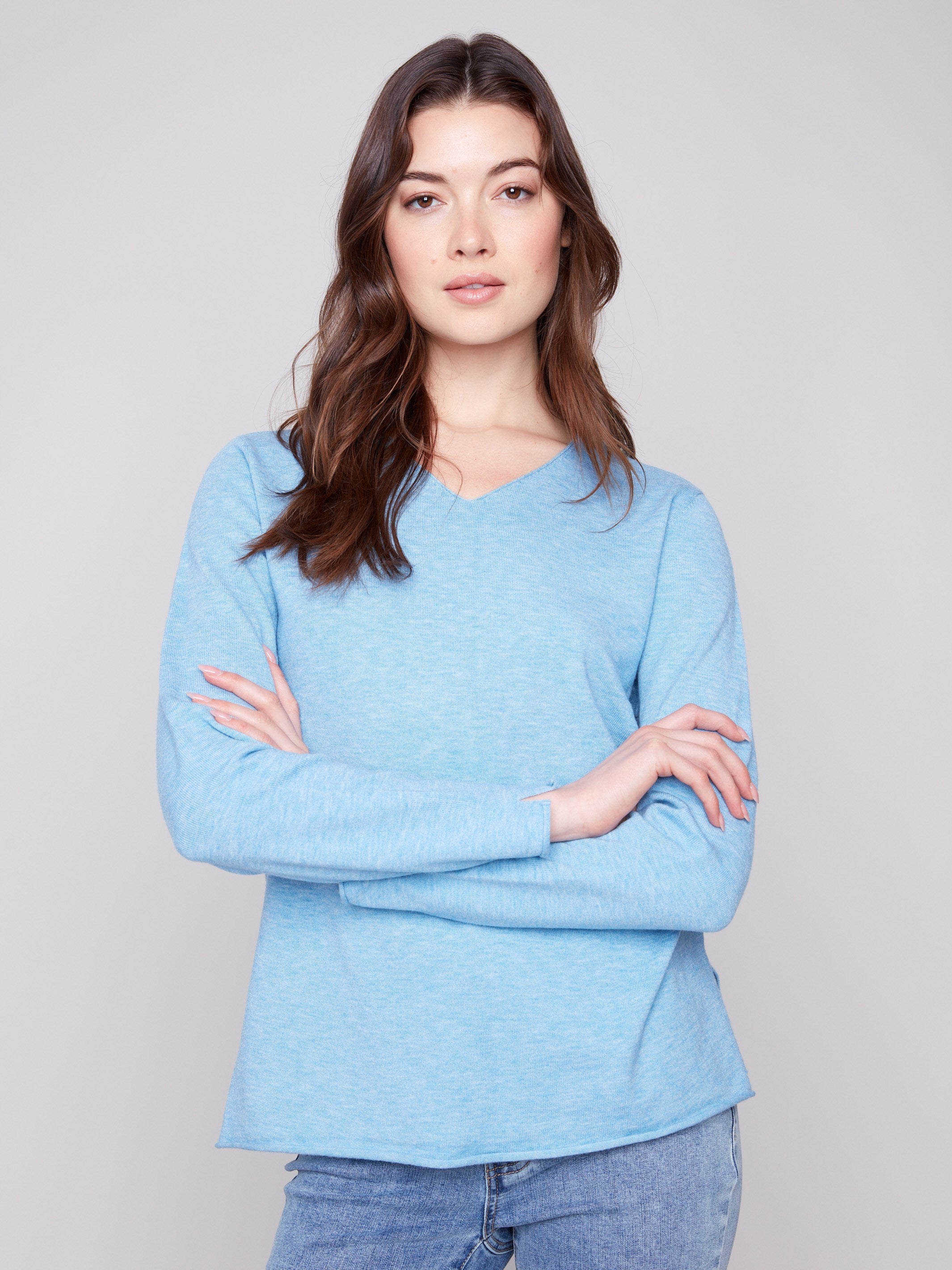 Elegant V-neck sweater with side slits on sleeves and hem, perfect for a chic look by Charlie B.
