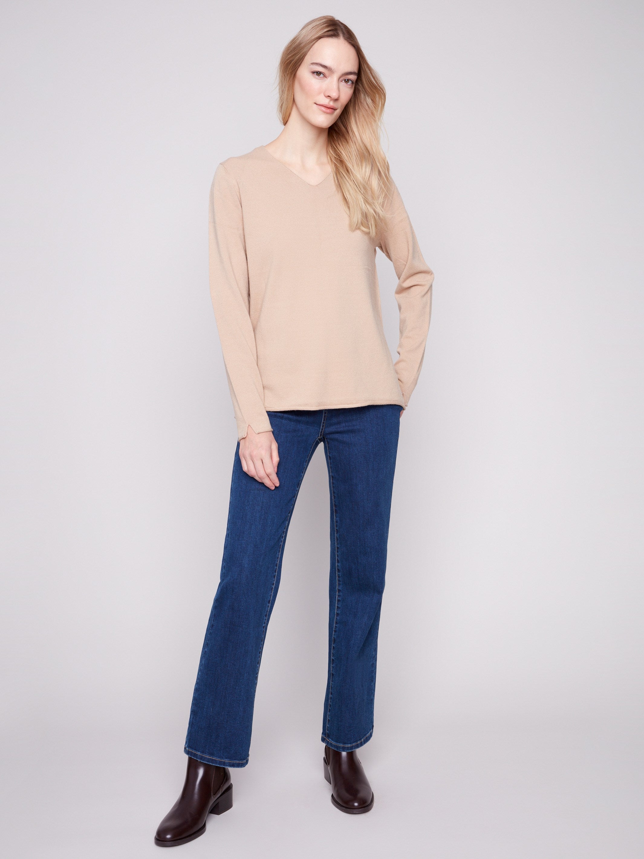 Long-sleeved sesame sweater with side slits on sleeves for added style by Charlie B.