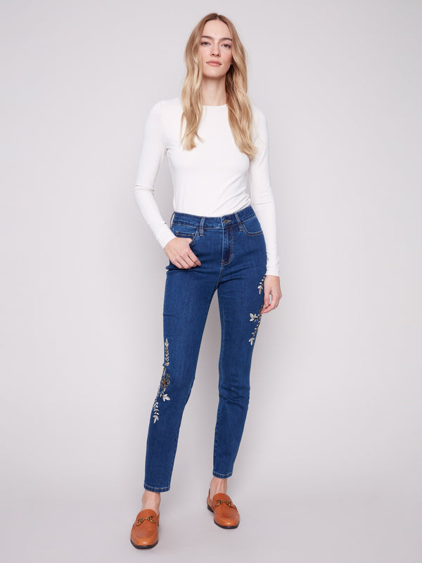 Indigo jeans featuring a skinny fit and elegant beaded embroidery, crafted in stretch denim for comfort by Charlie B.