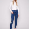 Indigo jeans featuring a skinny fit and elegant beaded embroidery, crafted in stretch denim for comfort by Charlie B.