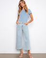 These wide-leg jeans feature a stylish cropped length, perfect for casual outings. The light wash adds a fresh look by Charlie B.