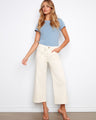 Natural-colored pants with a wide-leg fit and regular rise, ideal for versatile styling by Charlie B.