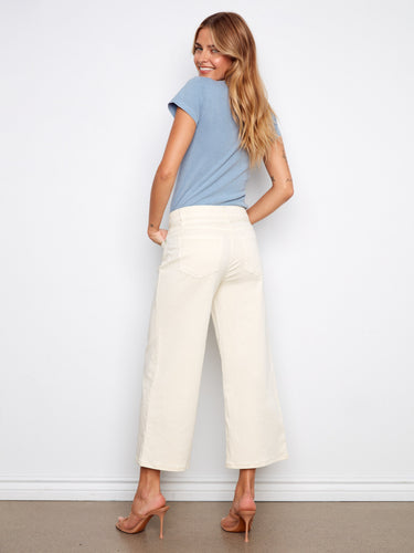 Wide-leg cropped pants with functional five-pocket detailing, adding practicality by Charlie B.