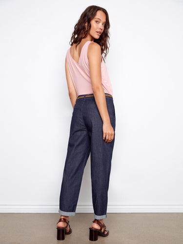 Showcasing slash pockets for practicality, these deep blue denim pants combine fashion and function effortlessly by Charlie B.