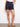 Featuring a stylish belted design with pintucks for added flair by Charlie B.