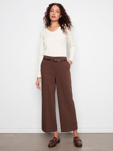 Brown wide leg crepe pants with a cropped length, styled elegantly with a white top by Charlie B.