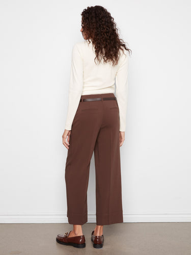 Experience the comfort of stretch crepe fabric in these brown pants, styled effortlessly with a white top by Charlie B.