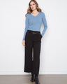 Black pants with a wide leg silhouette, offering a comfortable and stylish fit. Perfect for any occasion. By Charlie B.