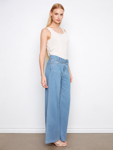 The belted design of these jeans adds a chic touch, ensuring a tailored fit that flatters the figure. By Charlie B.