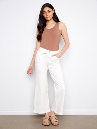 Featuring a regular rise and sleek white finish, these wide-leg pants are versatile for any occasion by Charlie B.