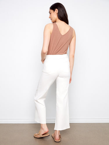Crafted in stretch twill fabric, these white wide-leg pants offer both style and comfort with their belted waist by Charlie B.