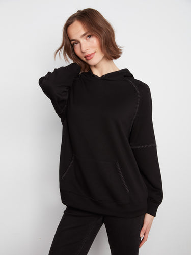 Designed with a hooded style, this piece adds an extra layer of warmth and style to your wardrobe. By Charlie B.
