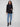 Black blazer featuring a tailored design and single-button closure, perfect for a sleek look by Charlie B.