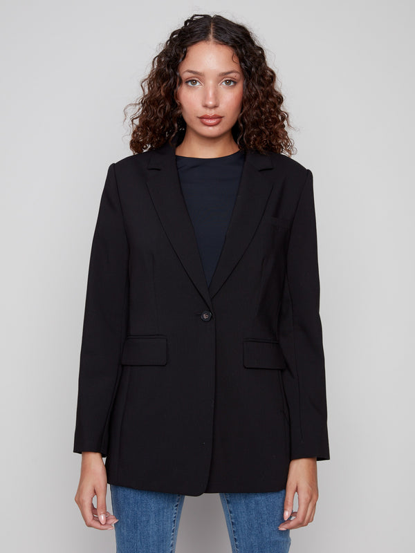 Elegant black blazer with lapel notch collar and front flap pockets for added style by Charlie B.