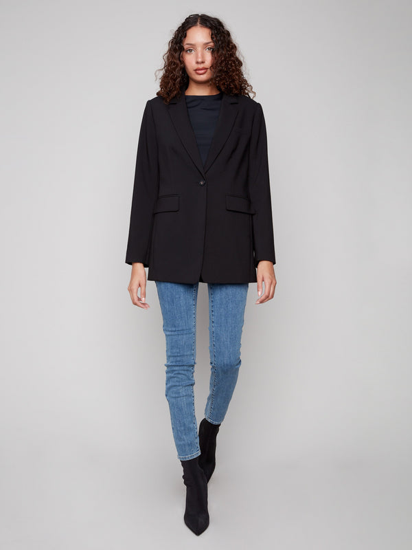 Sleek black blazer with long sleeves and buttoned cuffs, ideal for day-to-night wear by Charlie B.