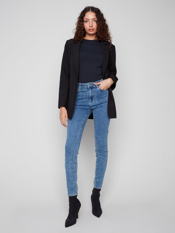 Stylish black blazer with welt pockets, combining functionality and fashion effortlessly by Charlie B.