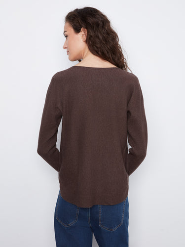 Back view of brown sweater showing rounded hem and seamless design paired with classic blue jeans for everyday wear by Charlie B.